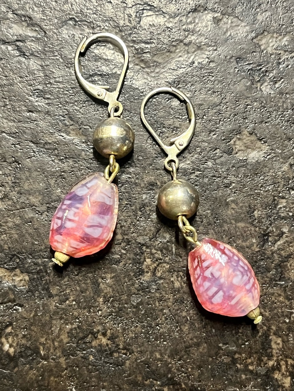 Silver earrings with pink dangling stones